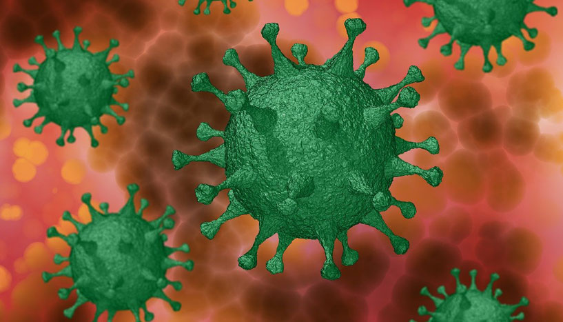 Grüne Coronaviren auf braun-orangem Hintergrund.